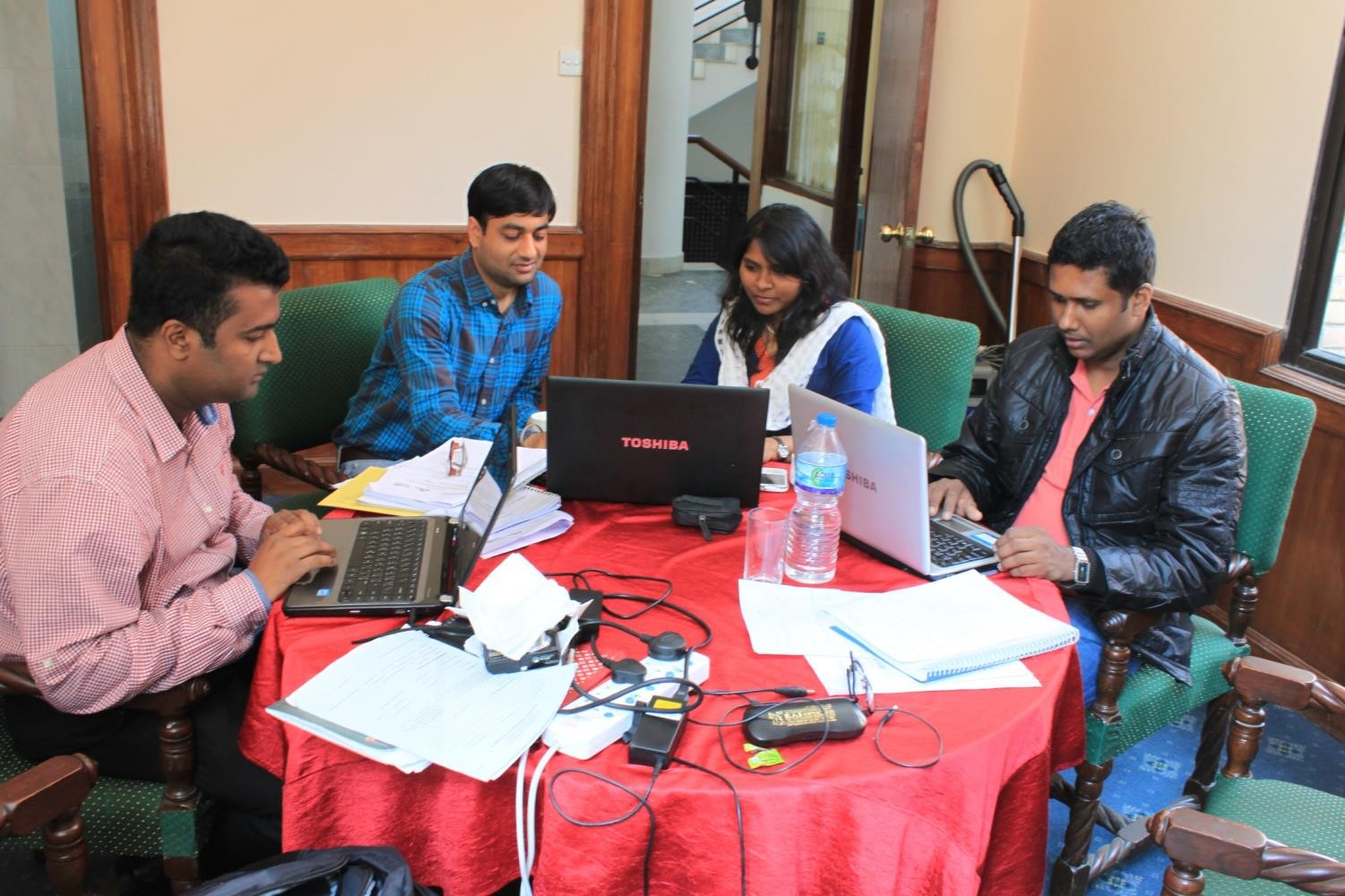 Team members working on proposal